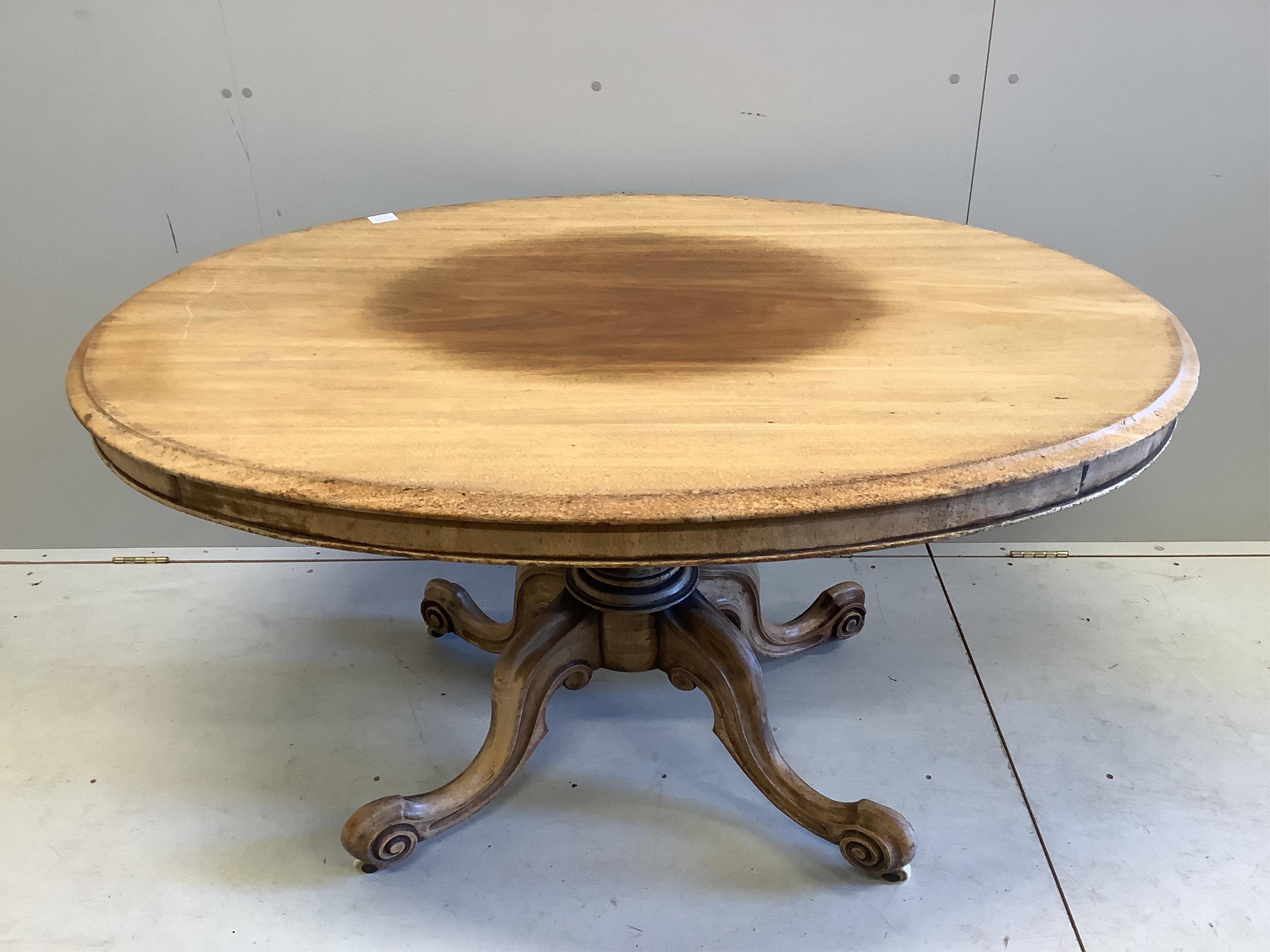A Victorian faded mahogany oval tilt top loo table, width 137cm, depth 103cm, height 73cm